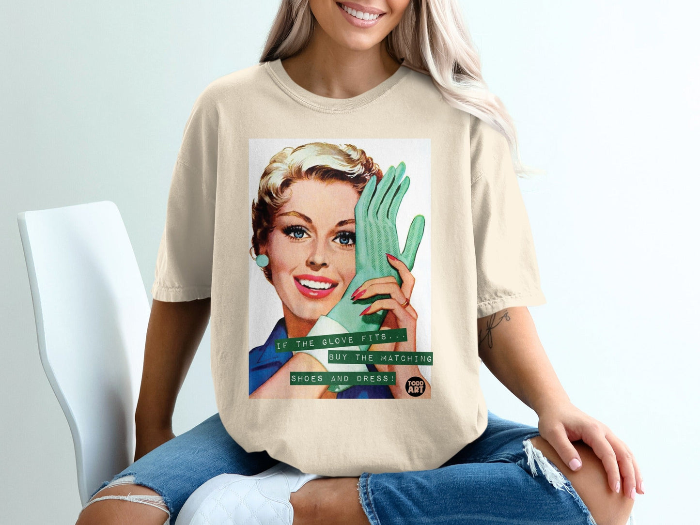 Woman in t-shirt holding mint green glove, text "if the glove fits buy the matching shoes and dress."