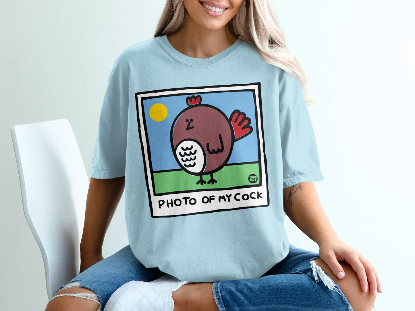 Light blue t-shirt with cartoon chicken and "PHOTO OF MY COCK" text.