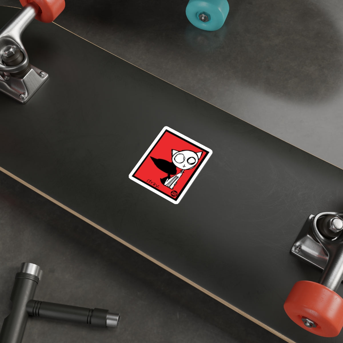 Cartoon Cat Sticker on Black Skateboard Deck