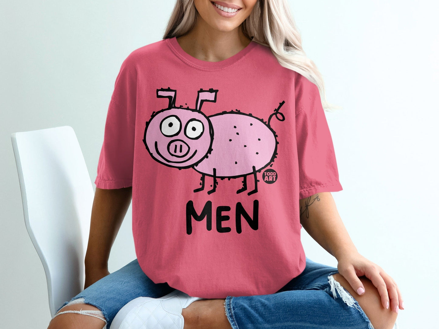 Pink t-shirt with a cartoon pig graphic and "MEN" text.