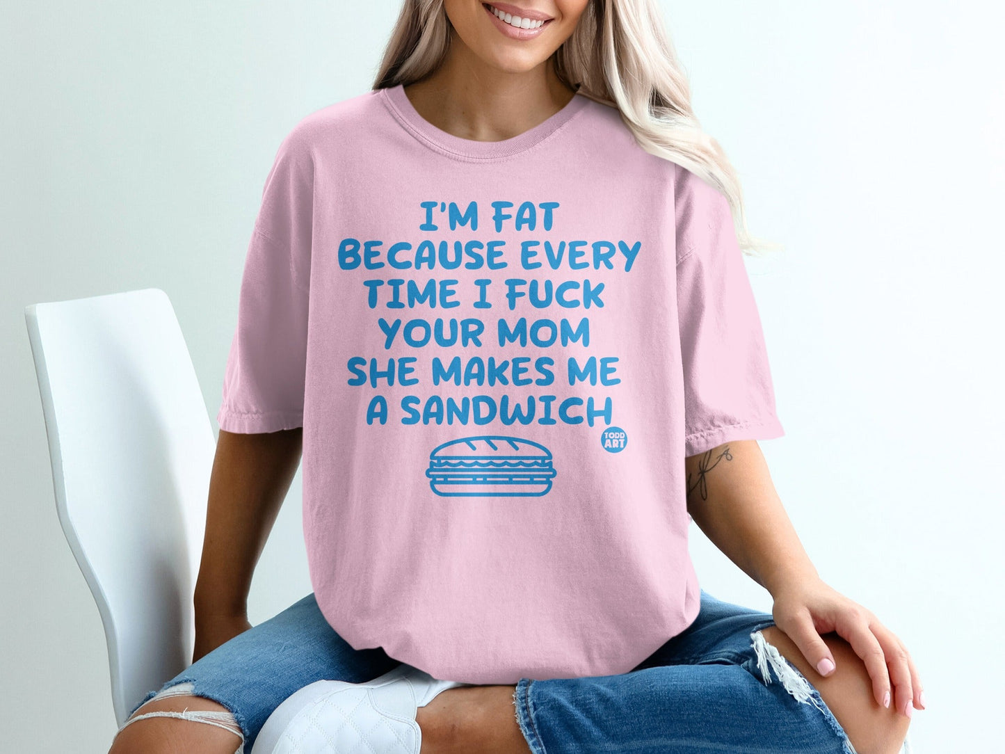 Pink t-shirt with text "I'm fat because every time I fuck your mom she makes me a sandwich" and a sandwich graphic.