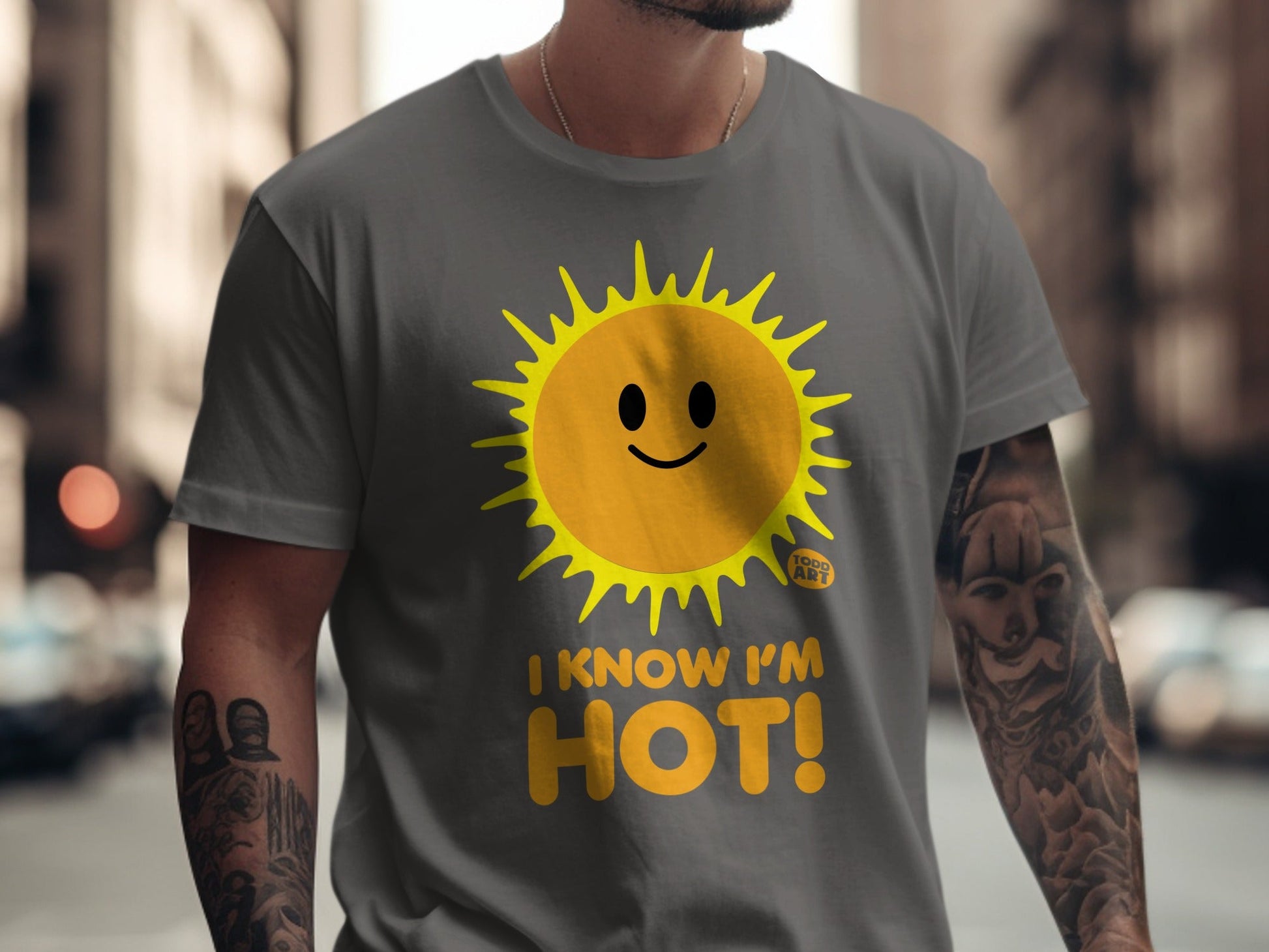 Gray t-shirt with a smiling sun graphic and "I KNOW I'M HOT!" text.
