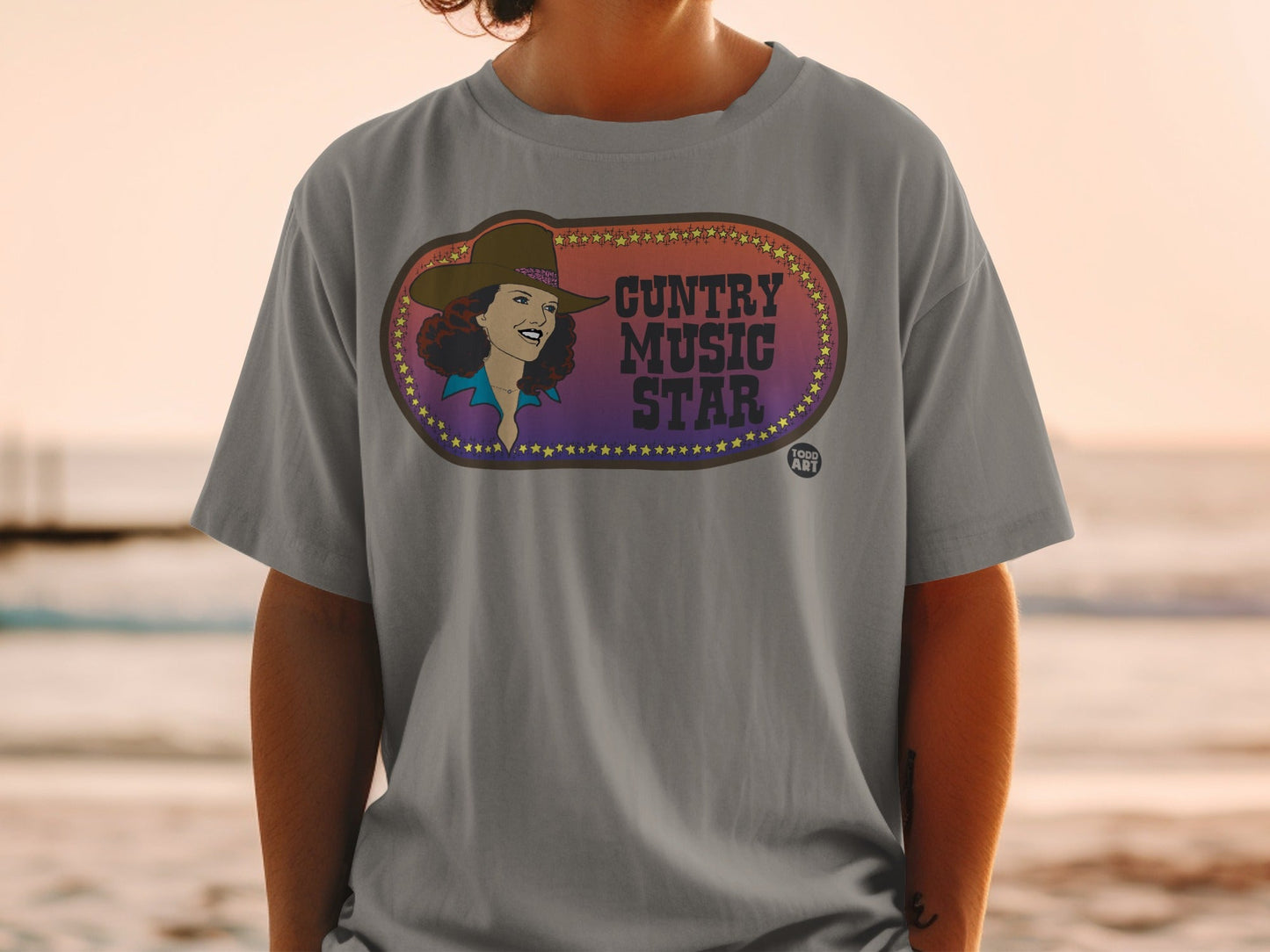 Grey t-shirt with "Country Music Star" text and vintage woman illustration.
