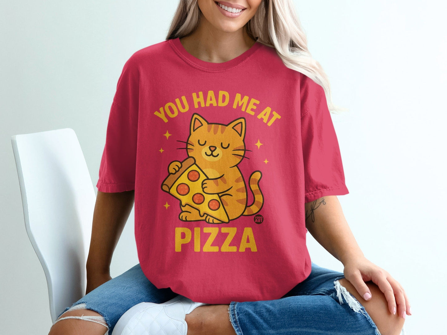 T-shirt with orange cat holding pizza slice, text "You had me at pizza".