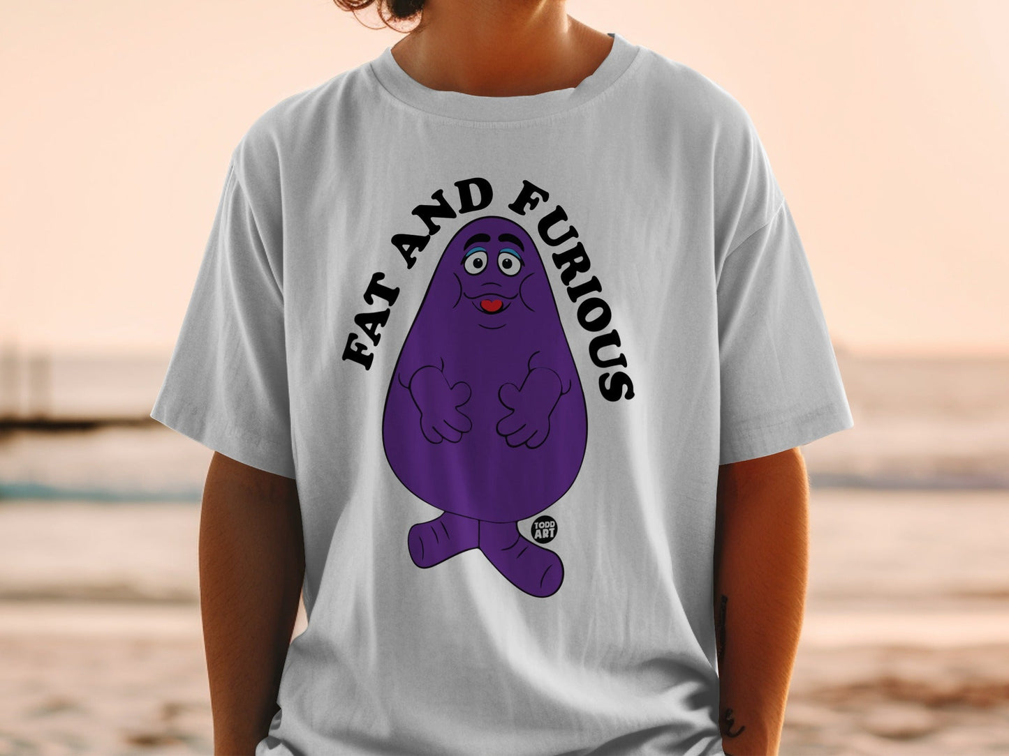 Purple character with text "FAT AND FURIOUS" on a white t-shirt.