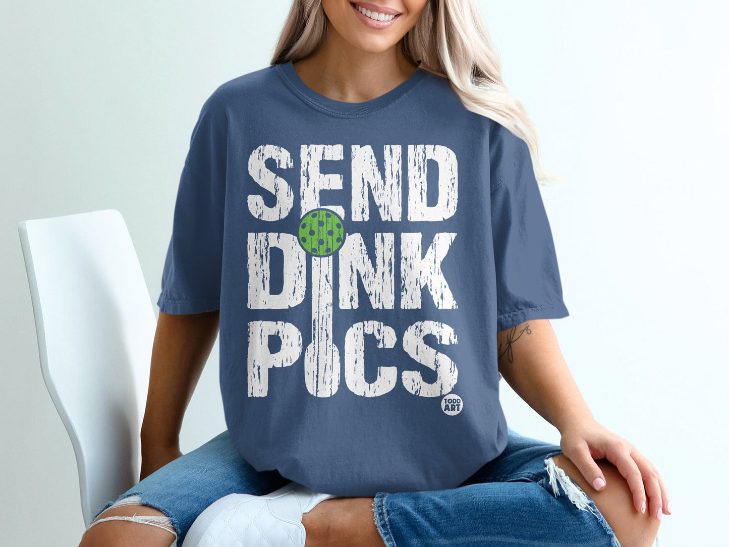 Blue t-shirt with distressed "SEND DINK PICS" text and pickleball graphic.
