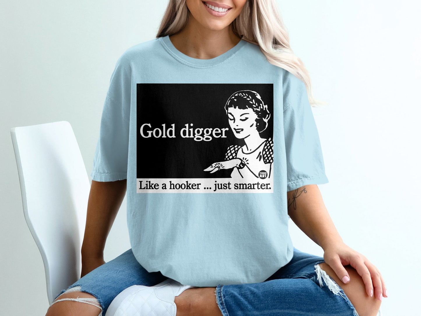 Light blue t-shirt with "Gold digger Like a hooker ... just smarter" text and vintage woman illustration.