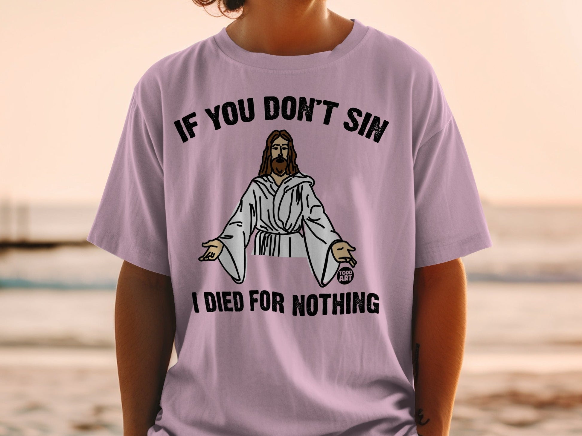 Pink t-shirt with Jesus graphic and text "IF YOU DON'T SIN I DIED FOR NOTHING".