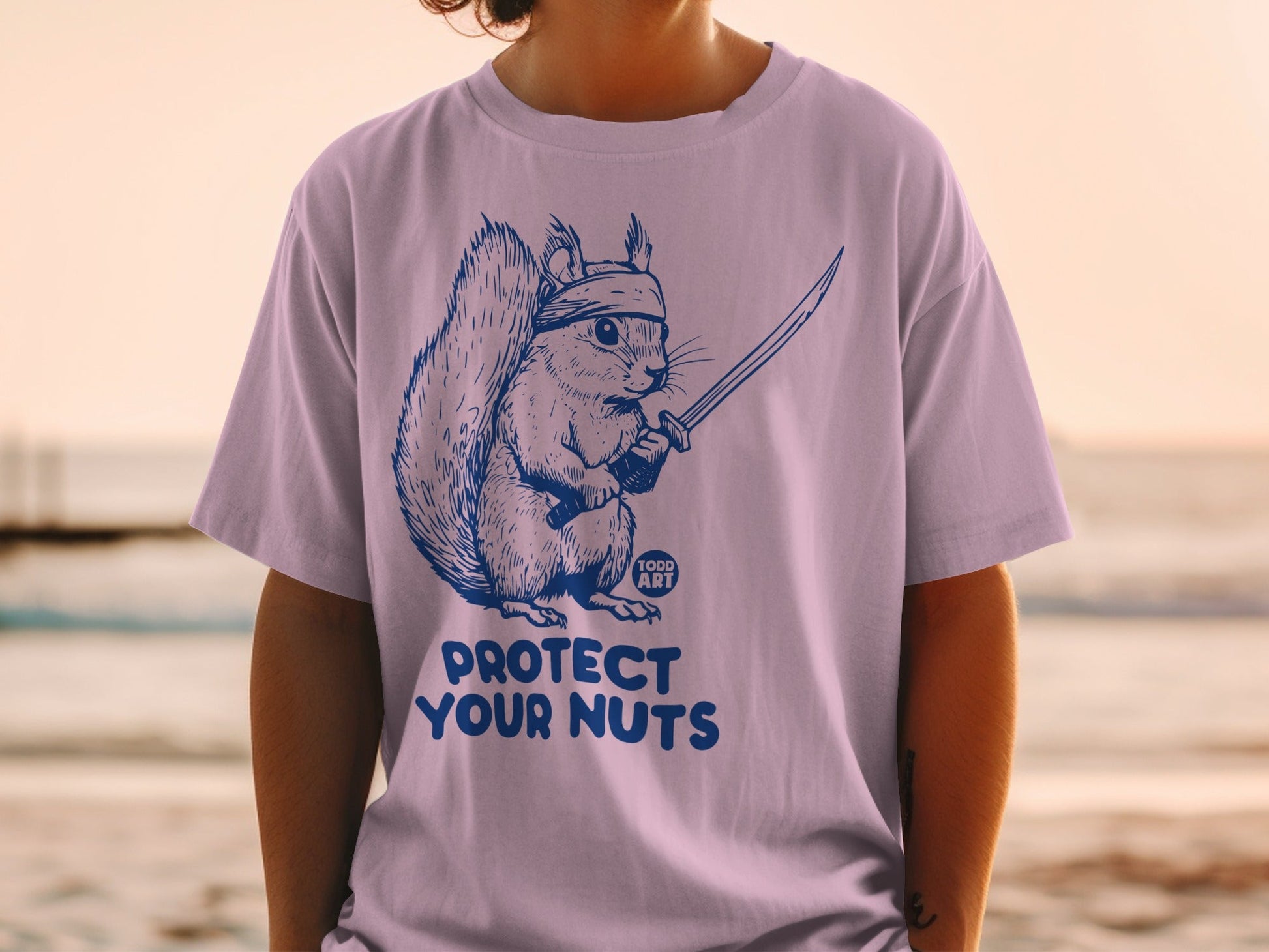 Squirrel in a bandana holding a katana sword with text "Protect Your Nuts" and "TODD ART".