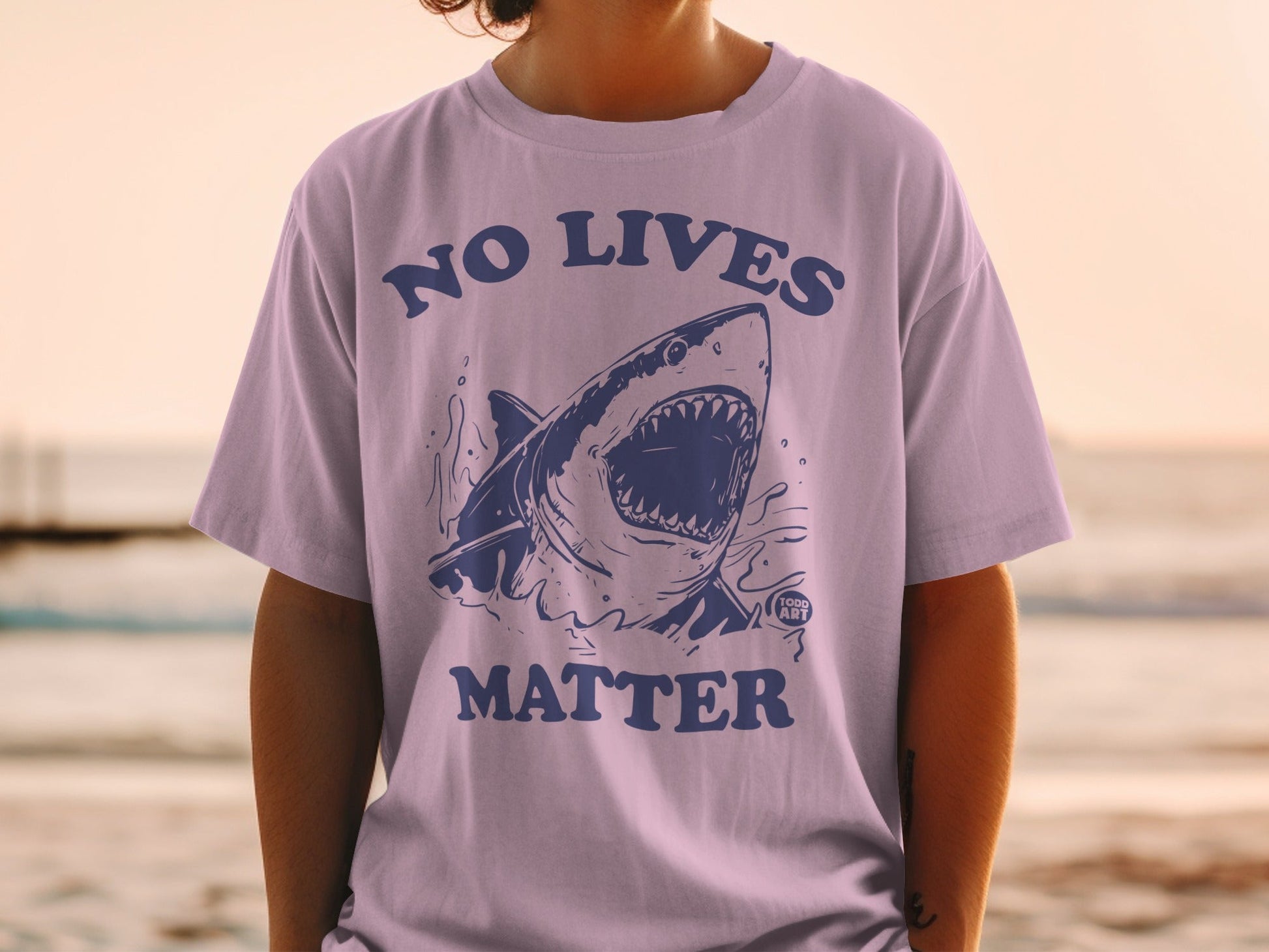 T-shirt with a blue shark illustration and "No Lives Matter" text.