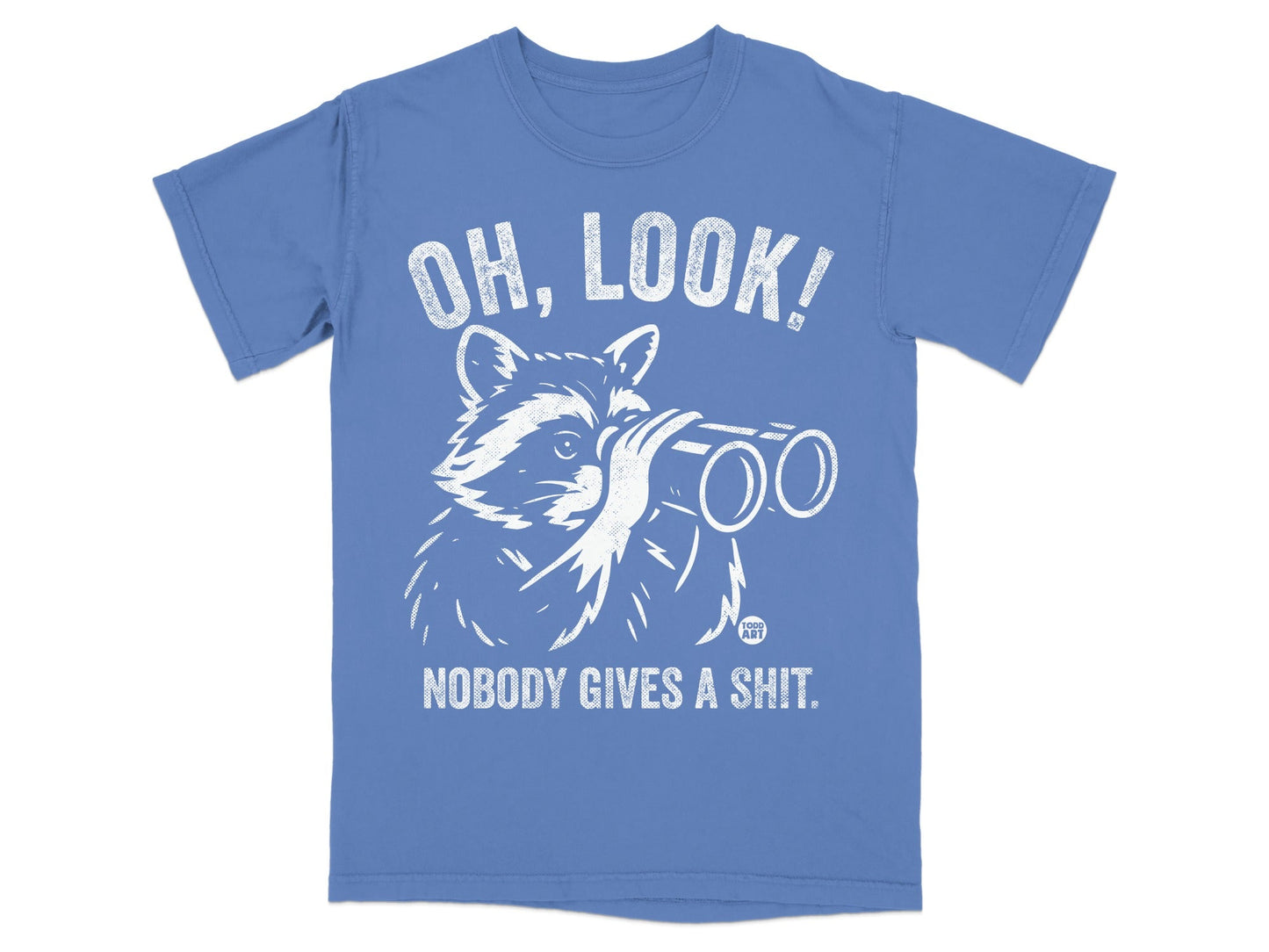 Blue t-shirt with white graphic of raccoon wearing binoculars, text reads "OH, LOOK! NOBODY GIVES A SHIT."