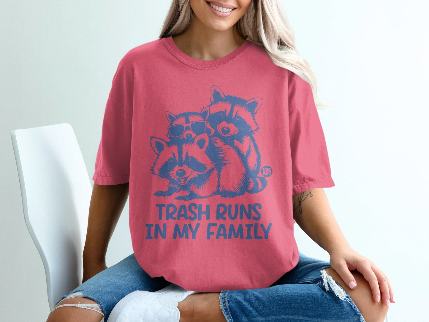 T-shirt with two raccoons wearing sunglasses and the text "TRASH RUNS IN MY FAMILY".
