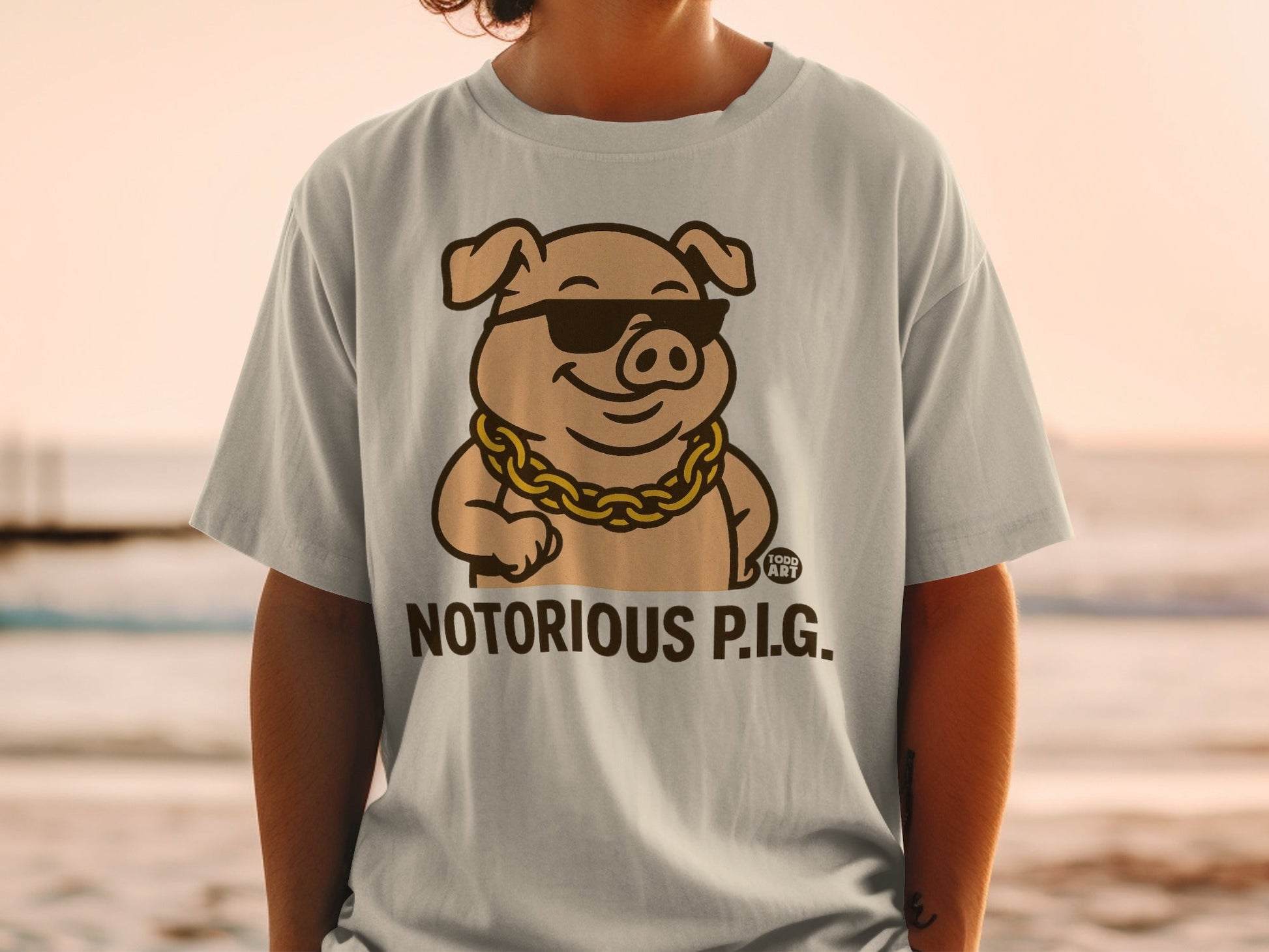 Cartoon pig wearing sunglasses and a gold chain, text "NOTORIOUS P.I.G."