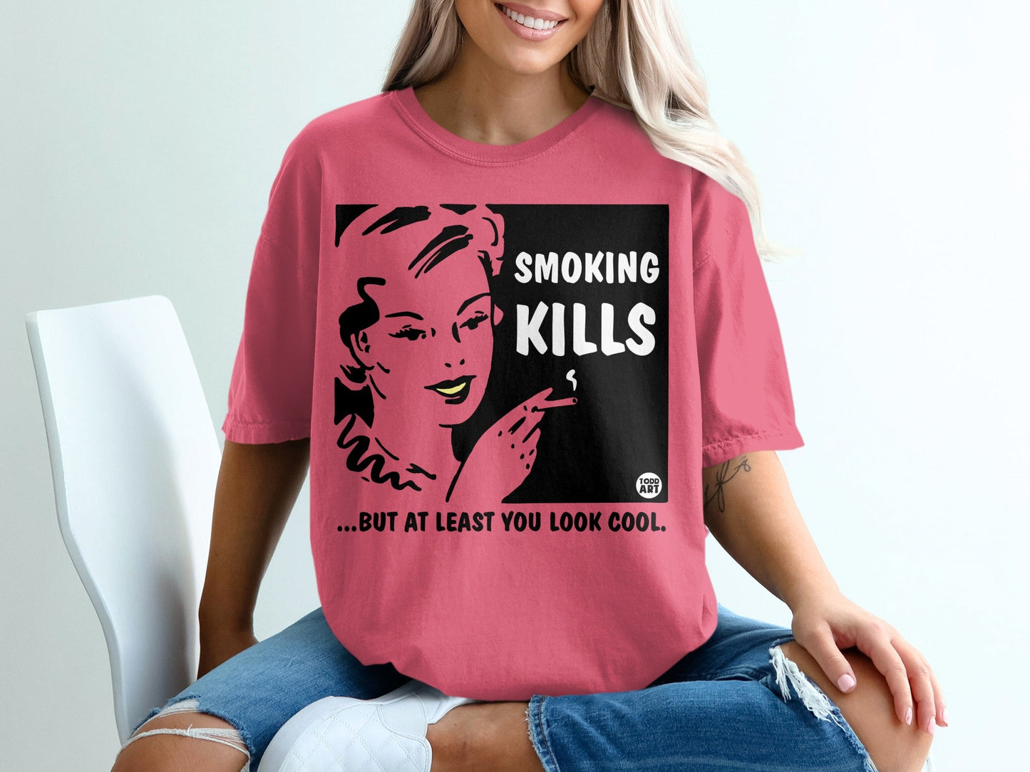 Woman in pink shirt with "Smoking Kills... But At Least You Look Cool" text.