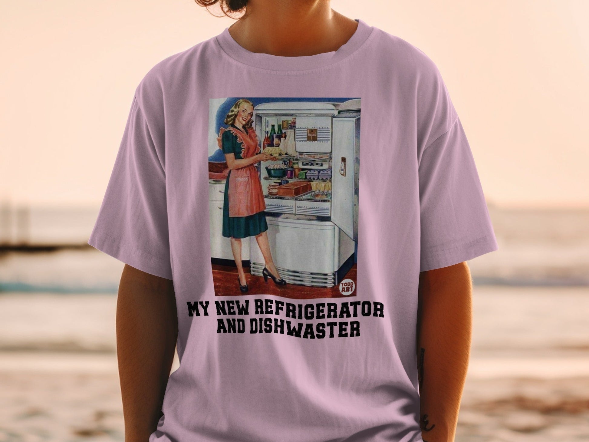 T-shirt graphic: woman in kitchen with refrigerator and dishwasher.
