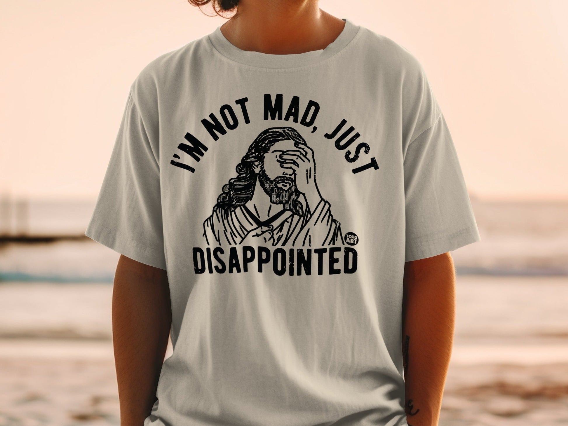 T-shirt with "I'm not mad, just disappointed" text and illustration of Jesus.