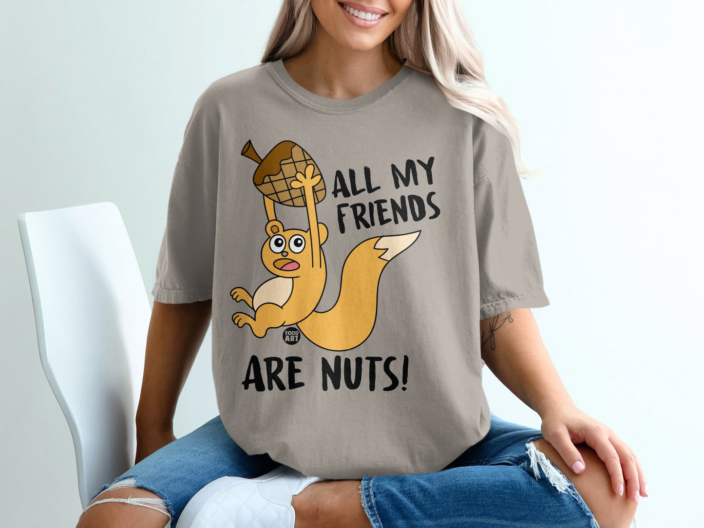 Squirrel holding acorn with text "All my friends are nuts!".