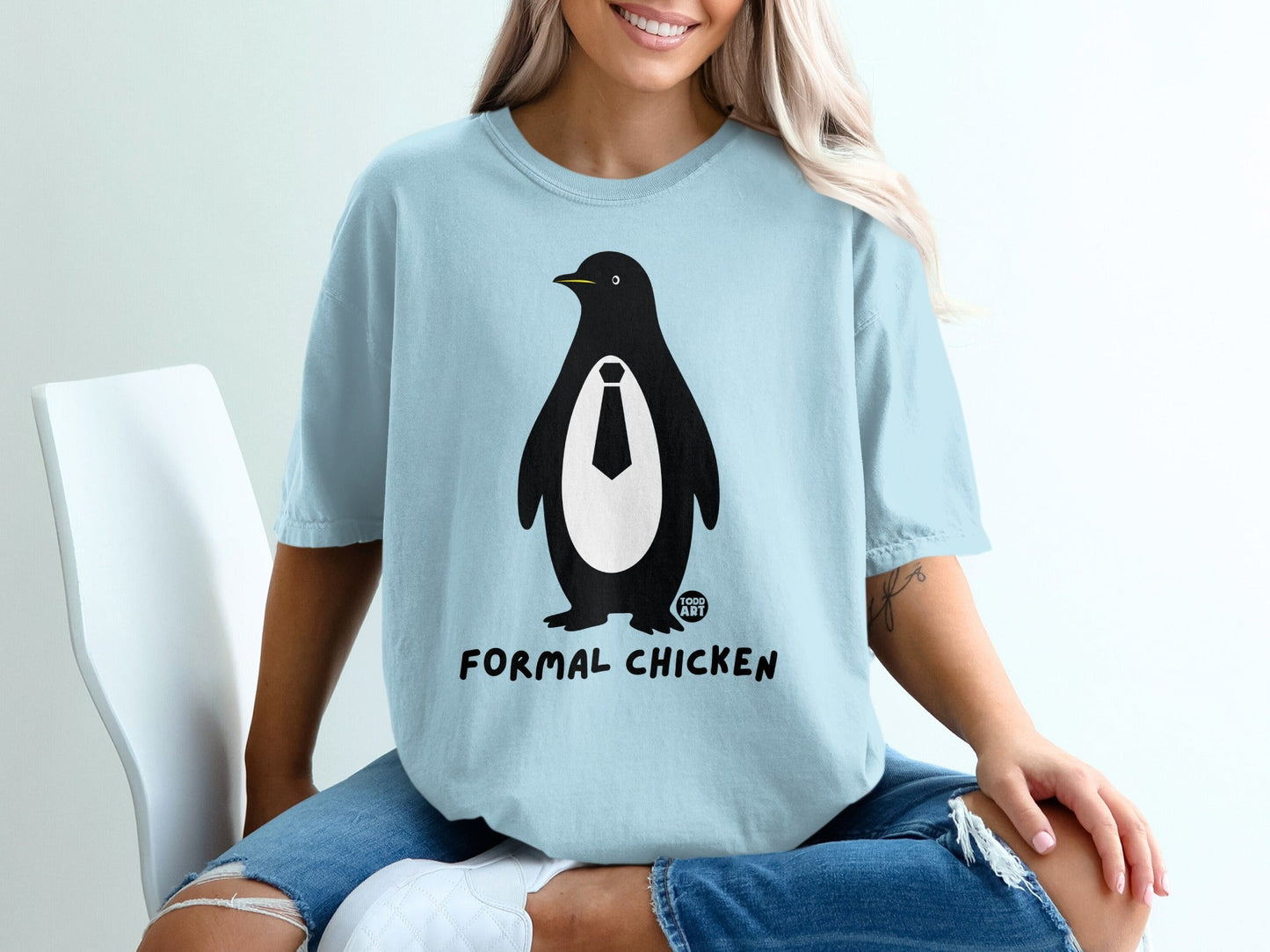 Light blue t-shirt with a penguin wearing a tie, "FORMAL CHICKEN" text.