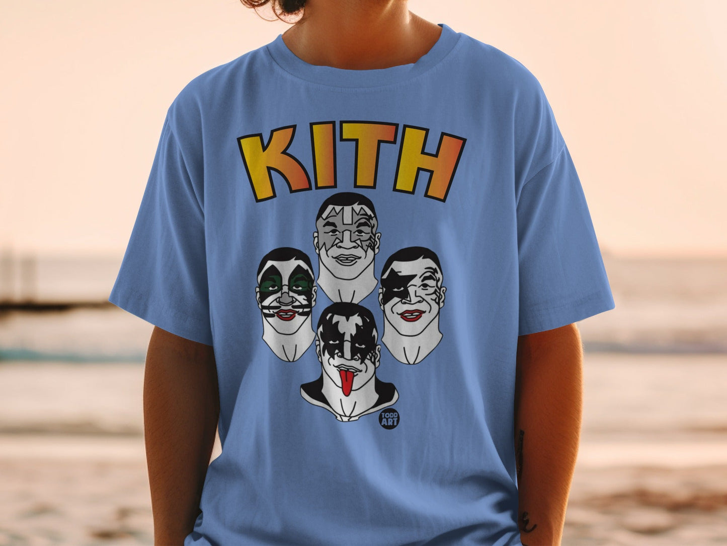 Kith t-shirt featuring KISS band members' makeup in cartoon style.