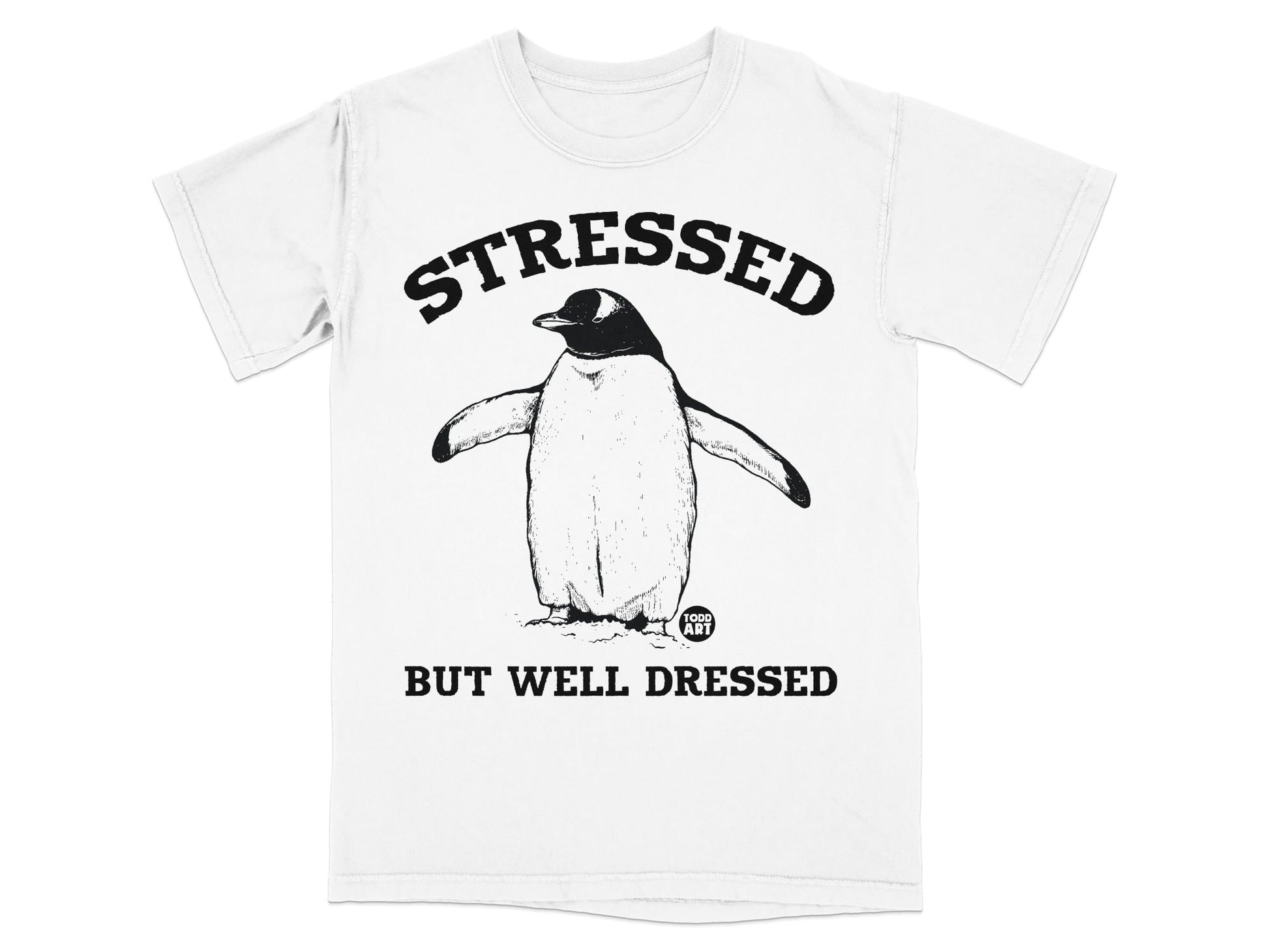 T-shirt with a penguin wearing a bow tie and text "STRESSED BUT WELL DRESSED".