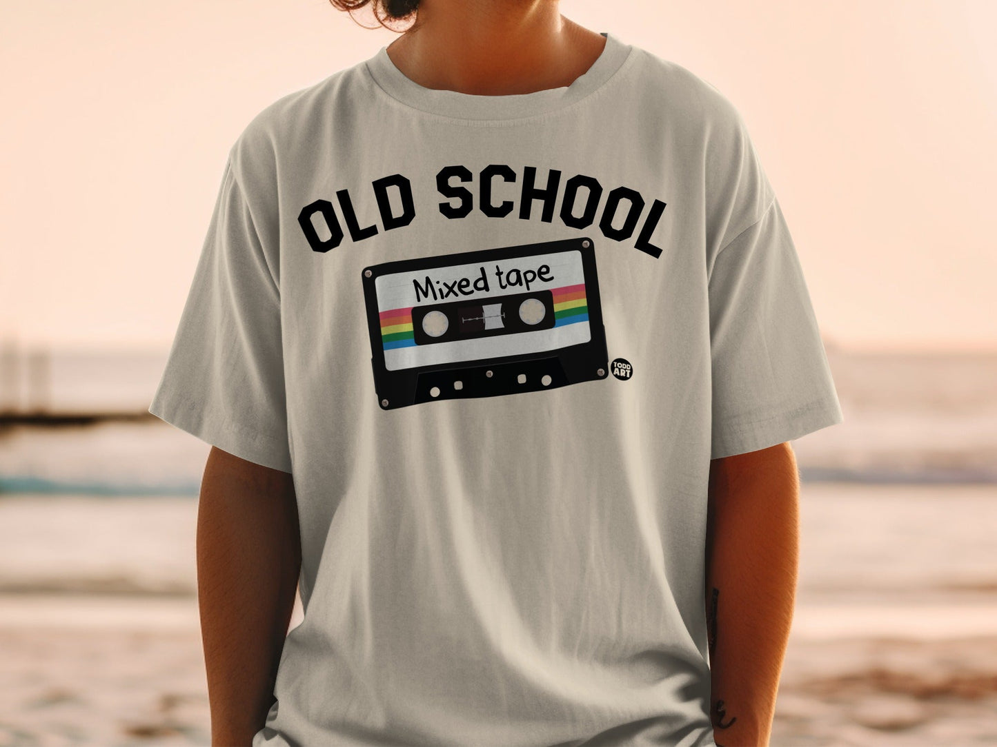 Black t-shirt with "OLD SCHOOL Mixed tape" graphic on a person.