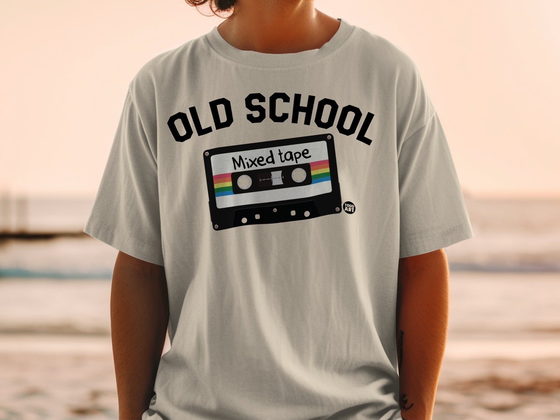 Black t-shirt with "OLD SCHOOL Mixed tape" graphic on a person.