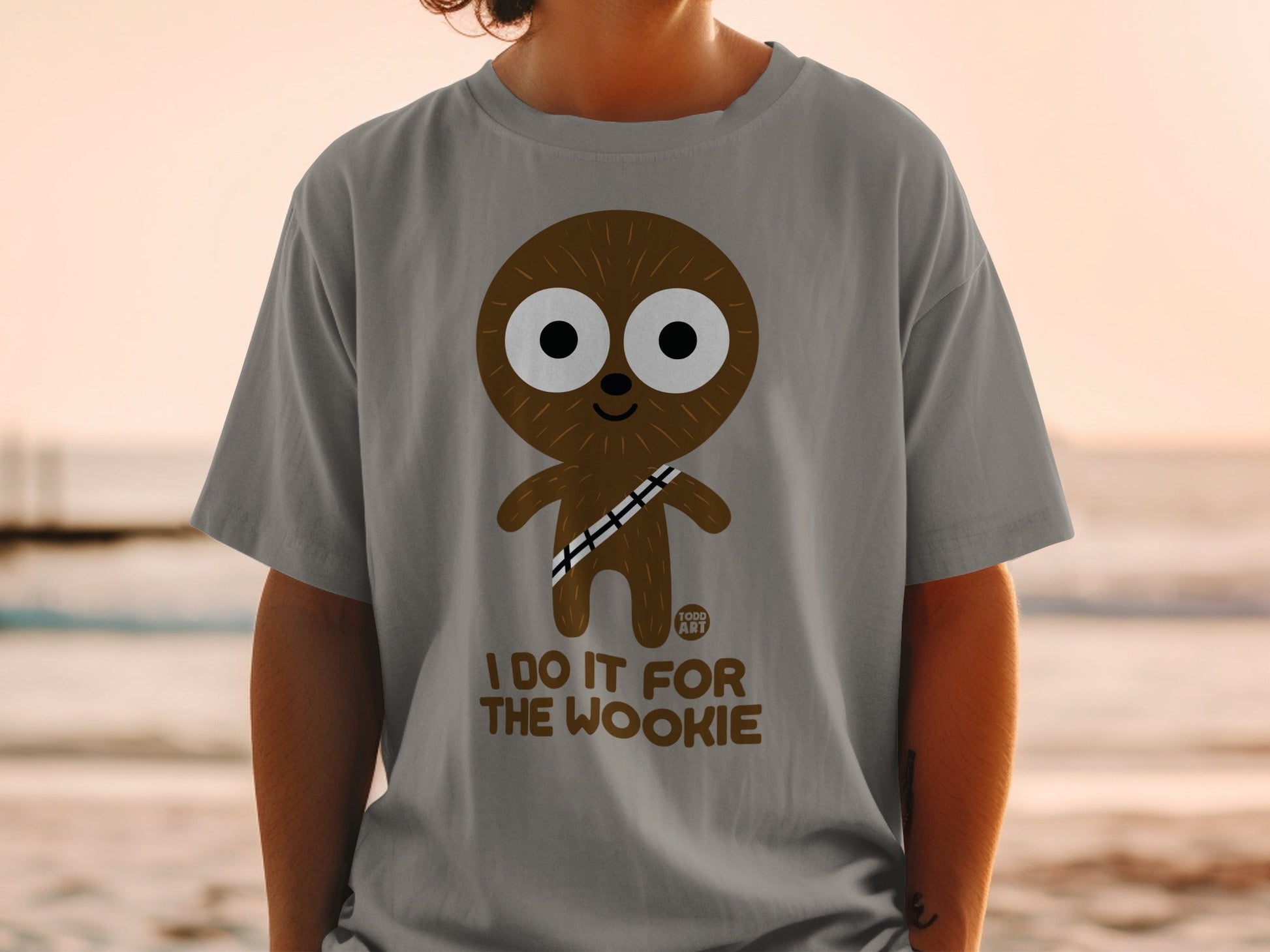 Brown cartoon character with large eyes on a grey t-shirt that reads "I DO IT FOR THE WOOKIE".