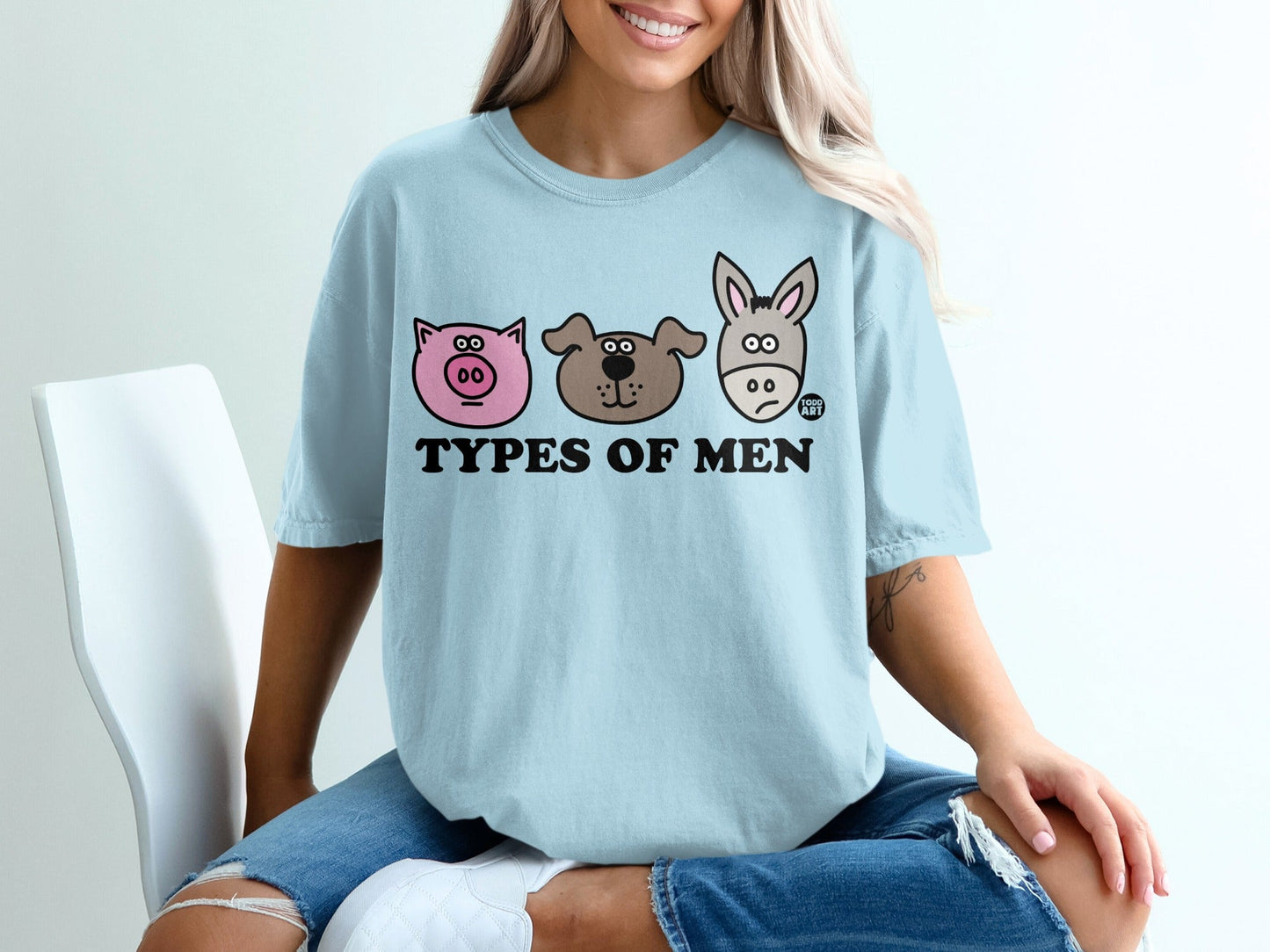 Light blue t-shirt with "Types of Men" graphic featuring a pig, dog, and donkey face.