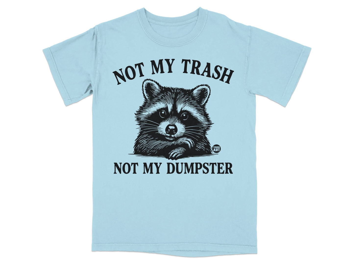 Light blue t-shirt with raccoon graphic and text: "NOT MY TRASH NOT MY DUMPSTER".