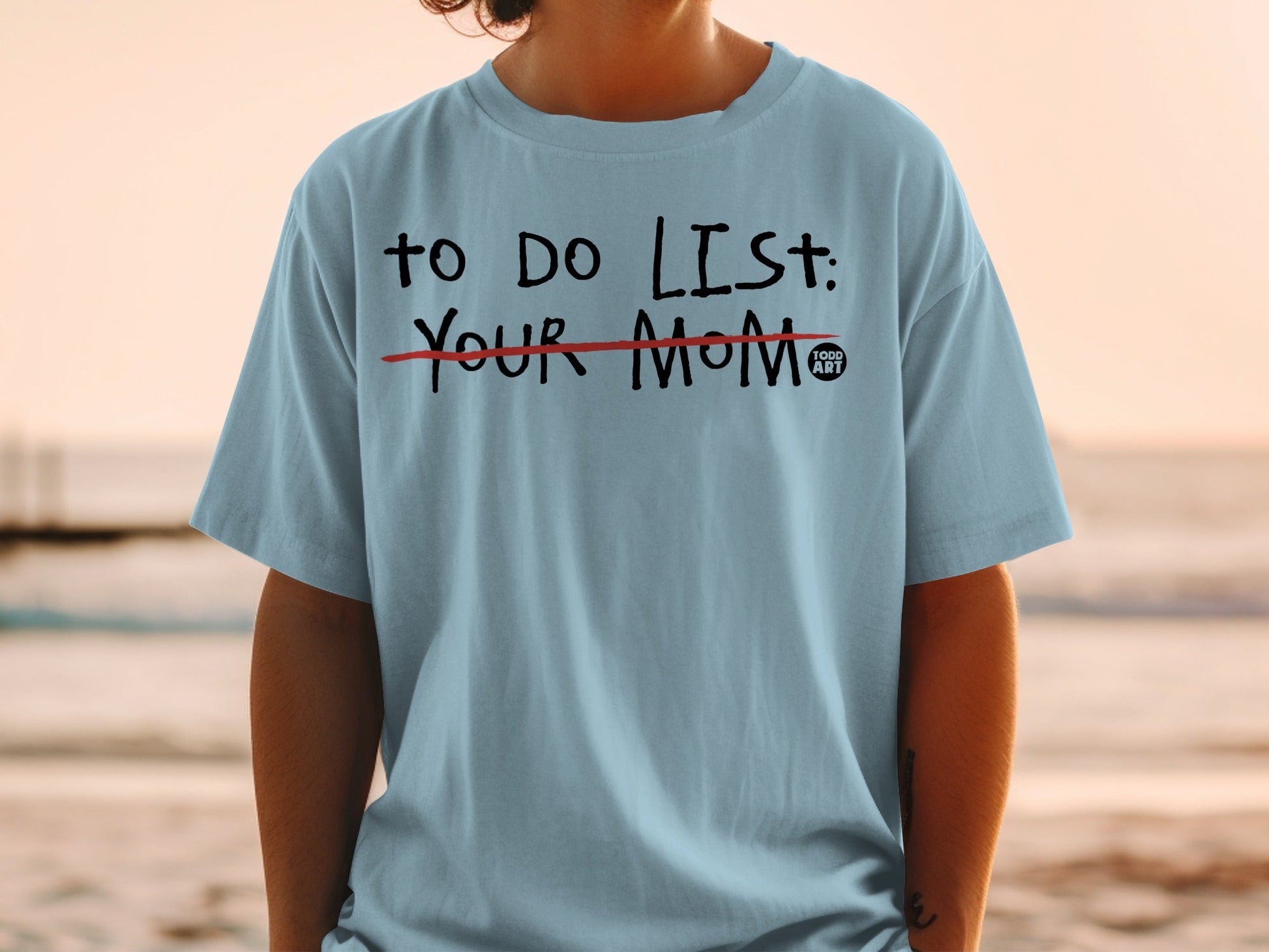 Light blue t-shirt with black text: "TO DO LIST: YOUR MOM".
