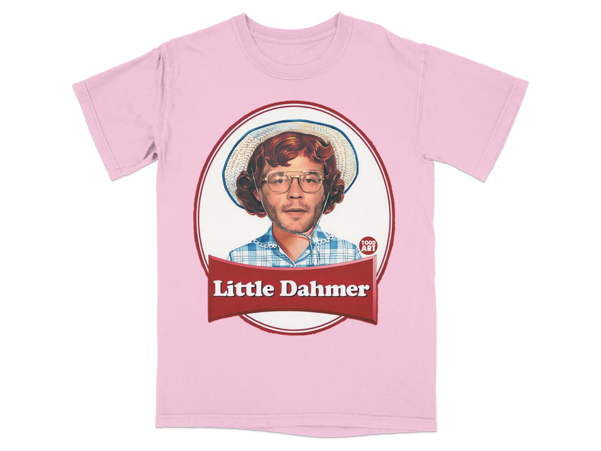 Pink t-shirt with a framed graphic of a person wearing glasses and a hat.