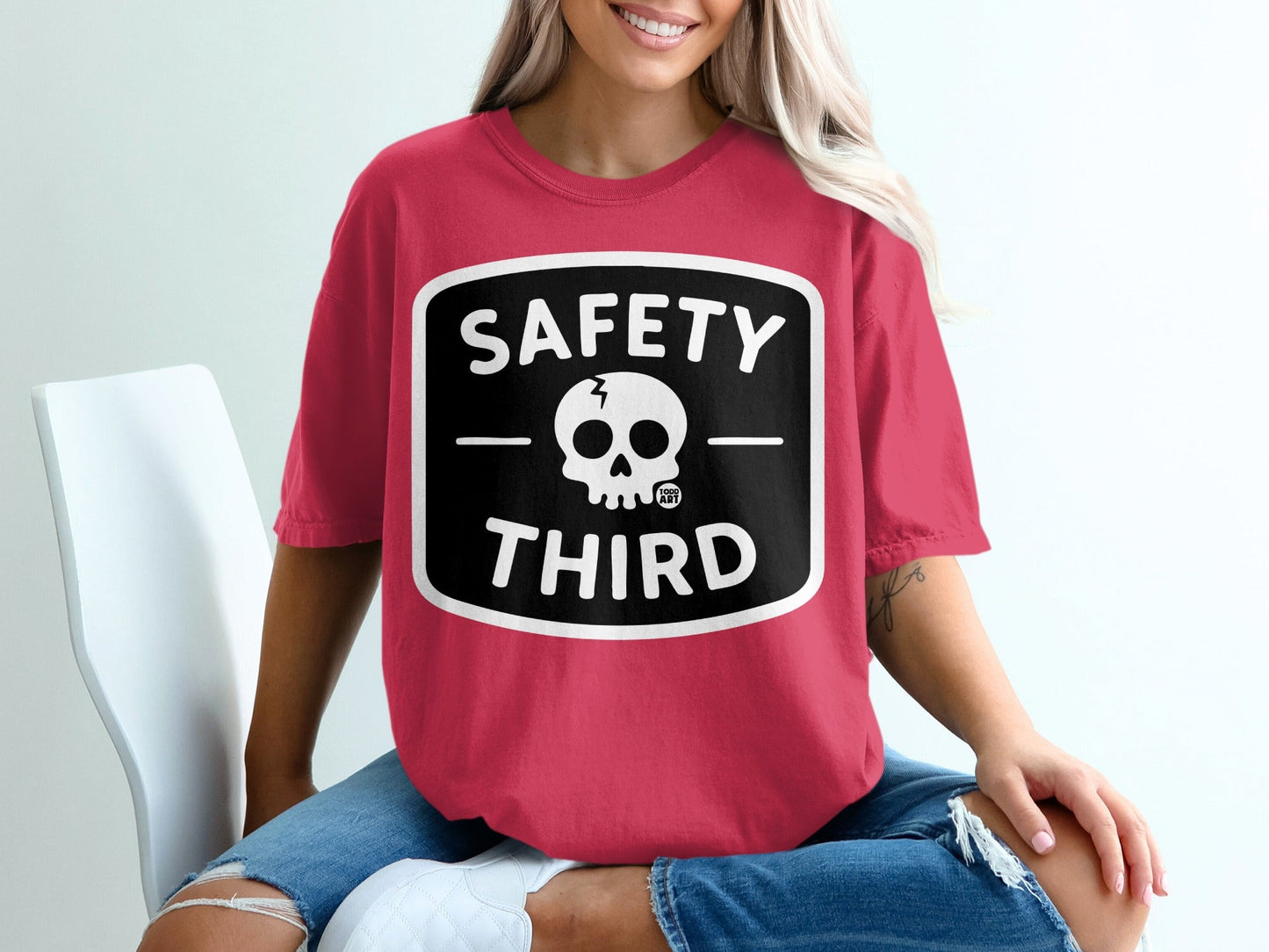 Crimson t-shirt with "Safety Third" text and skull graphic.