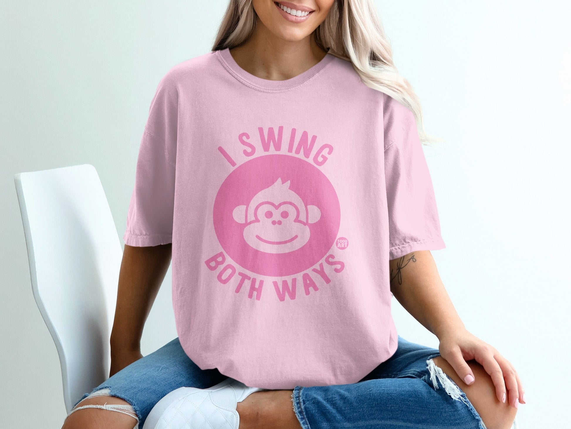 Pink t-shirt with "I swing both ways" and monkey graphic.