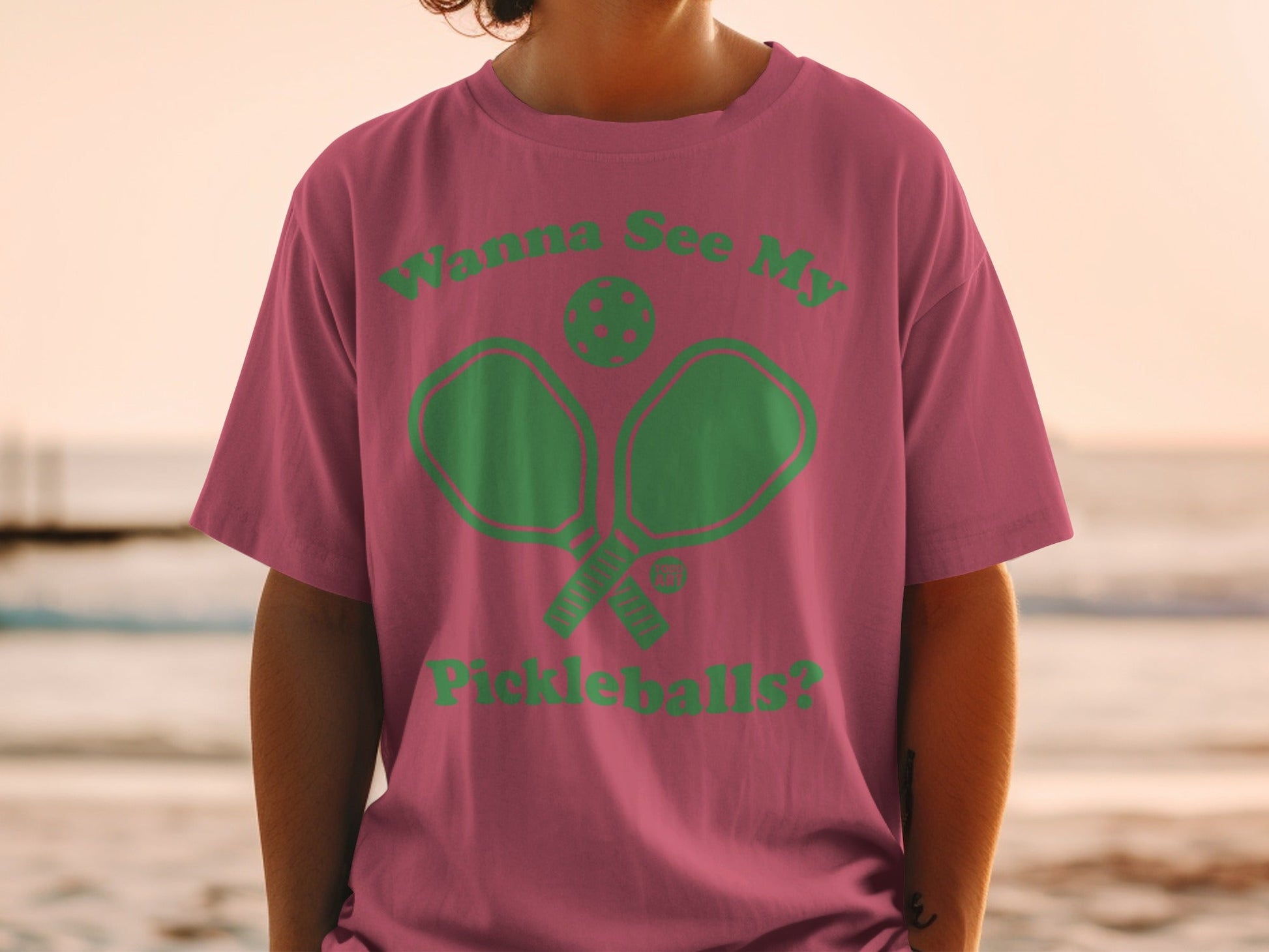 Pink t-shirt with "Wanna See My Pickleballs?" and pickleball graphic.