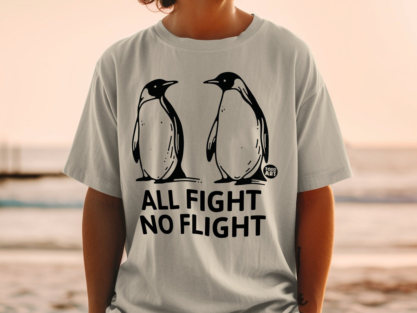 T-shirt with a graphic of two penguins and text "ALL FIGHT NO FLIGHT".