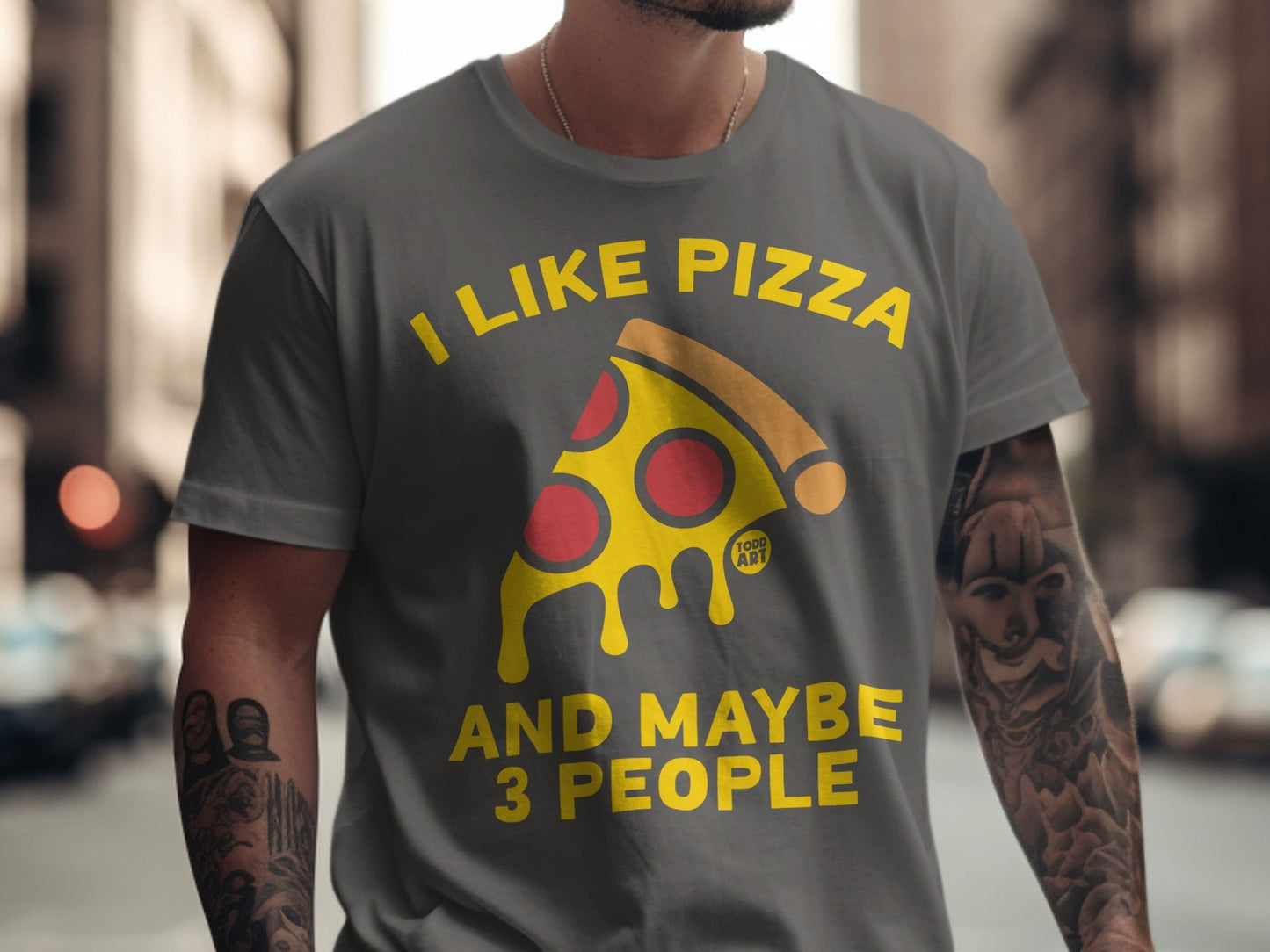 Gray t-shirt with yellow text "I LIKE PIZZA AND MAYBE 3 PEOPLE" and a pizza slice.