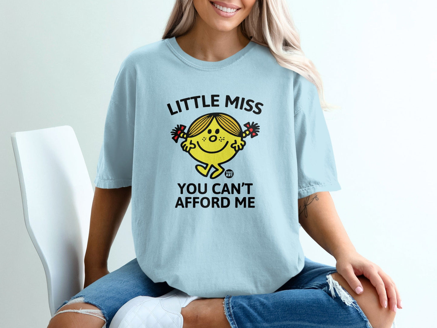 Light blue t-shirt with "Little Miss You Can't Afford Me" graphic.