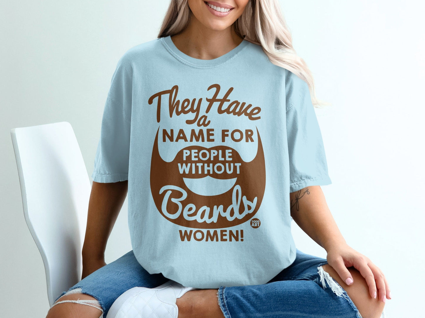 Light blue t-shirt with "They Have a Name For People Without Beards: WOMEN!" text.