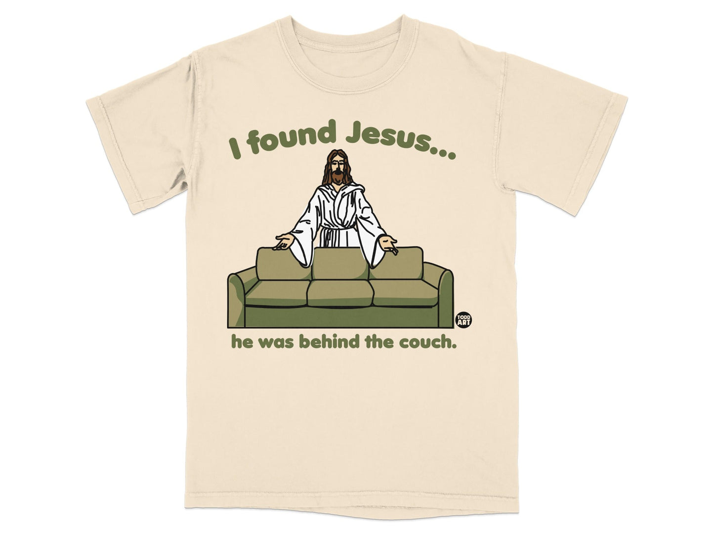 T-shirt with Jesus behind a couch, text reads "I found Jesus... he was behind the couch."