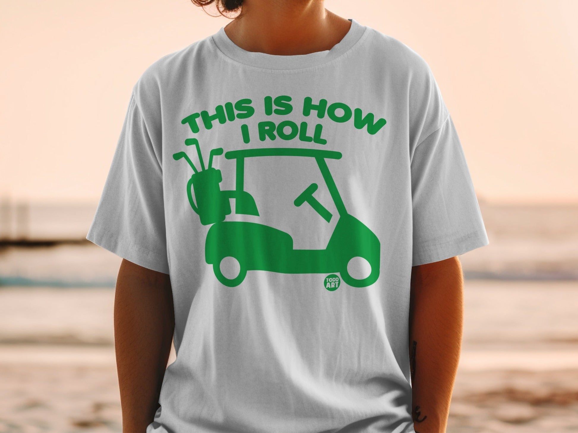Green graphic of golf cart and clubs with text "THIS IS HOW I ROLL".
