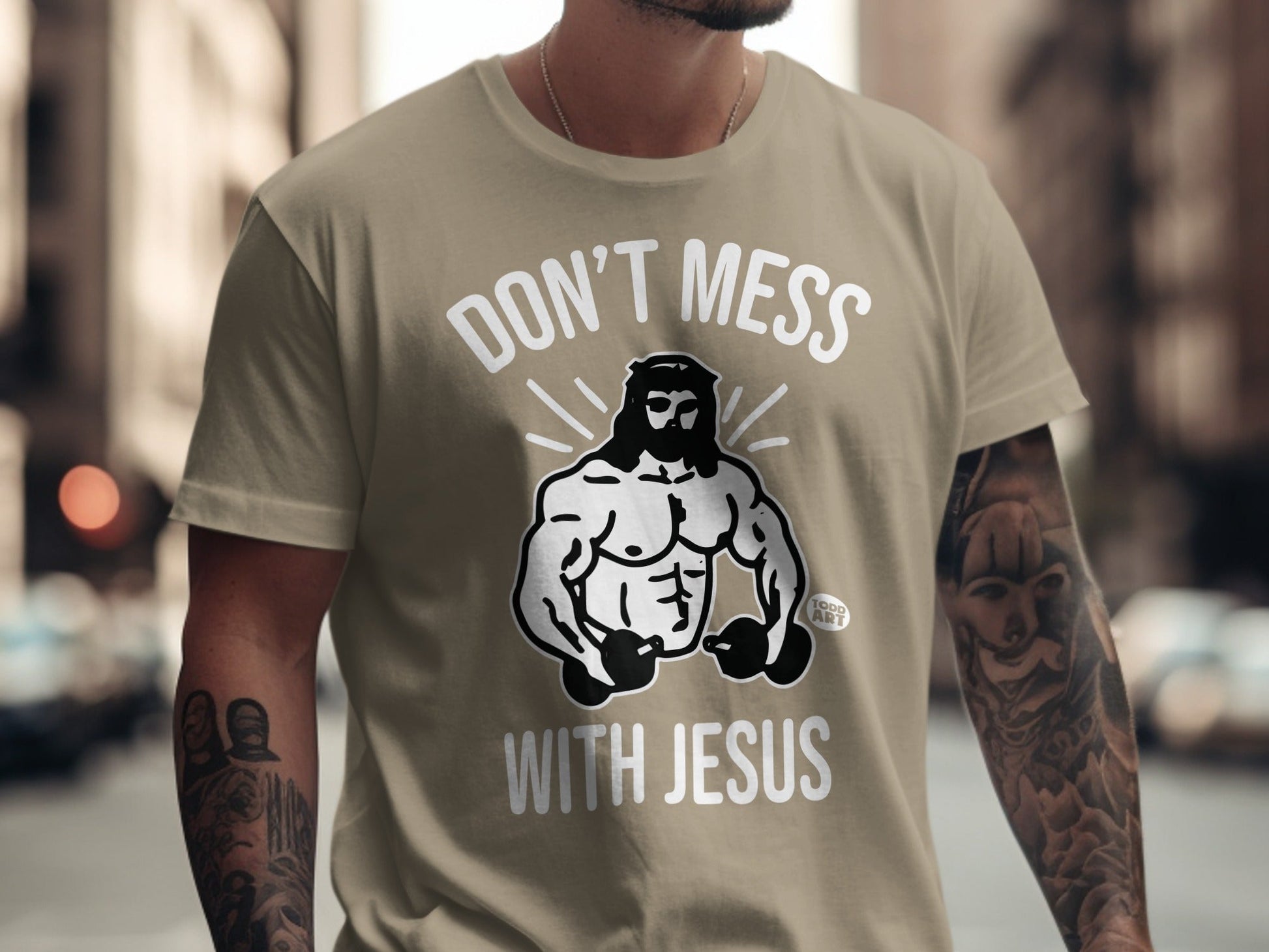 T-shirt with "Don't Mess With Jesus" and muscular Jesus holding dumbbells.