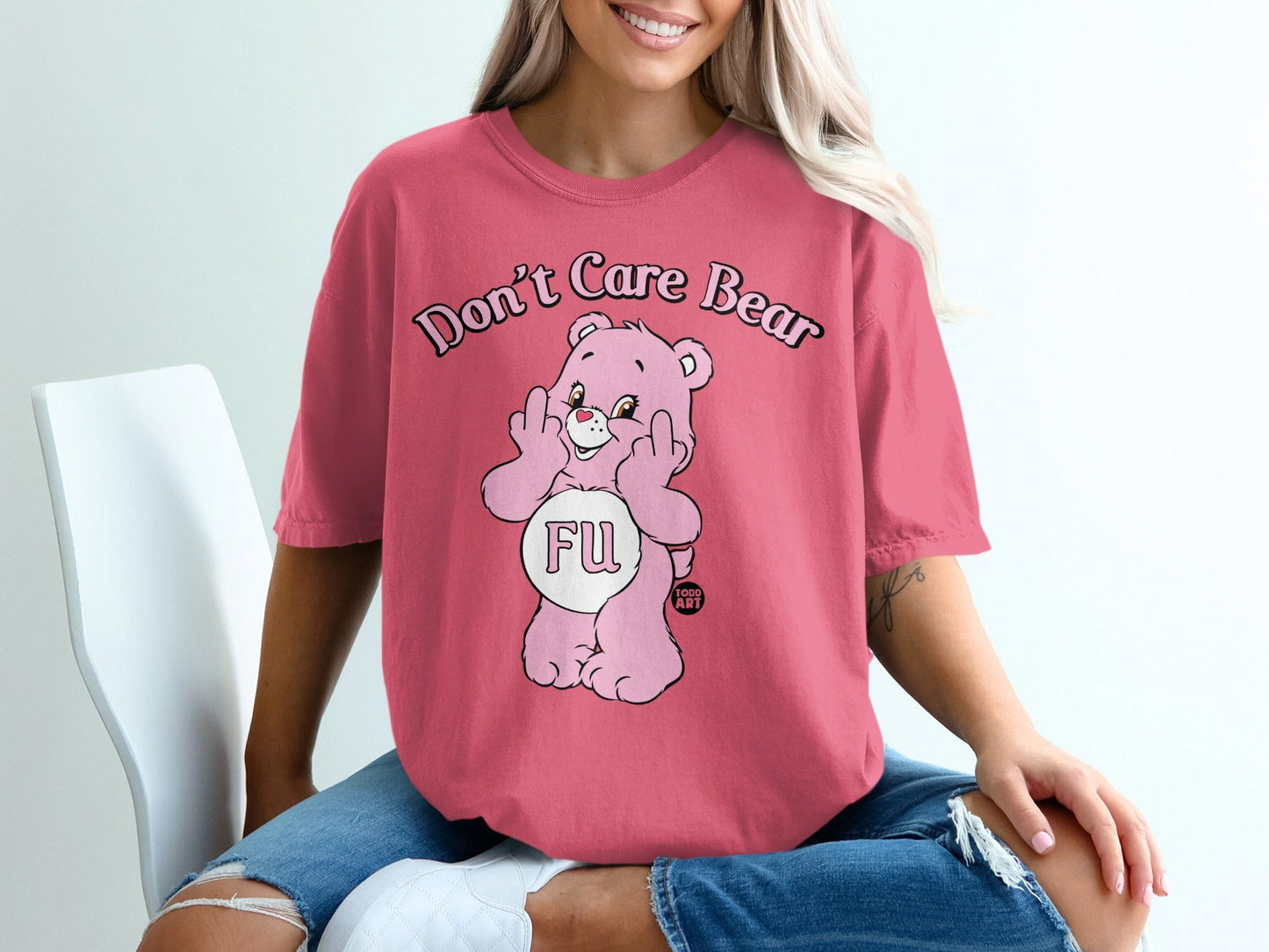 Pink bear graphic t-shirt with "Don't Care Bear FU" text.