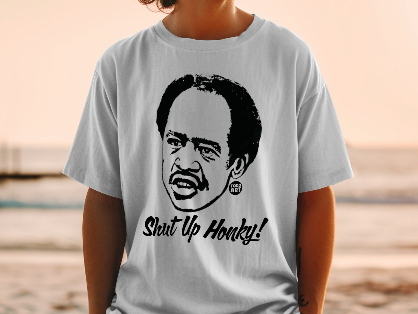 T-shirt with black graphic of Richard Pryor saying "Shut Up Honky!"