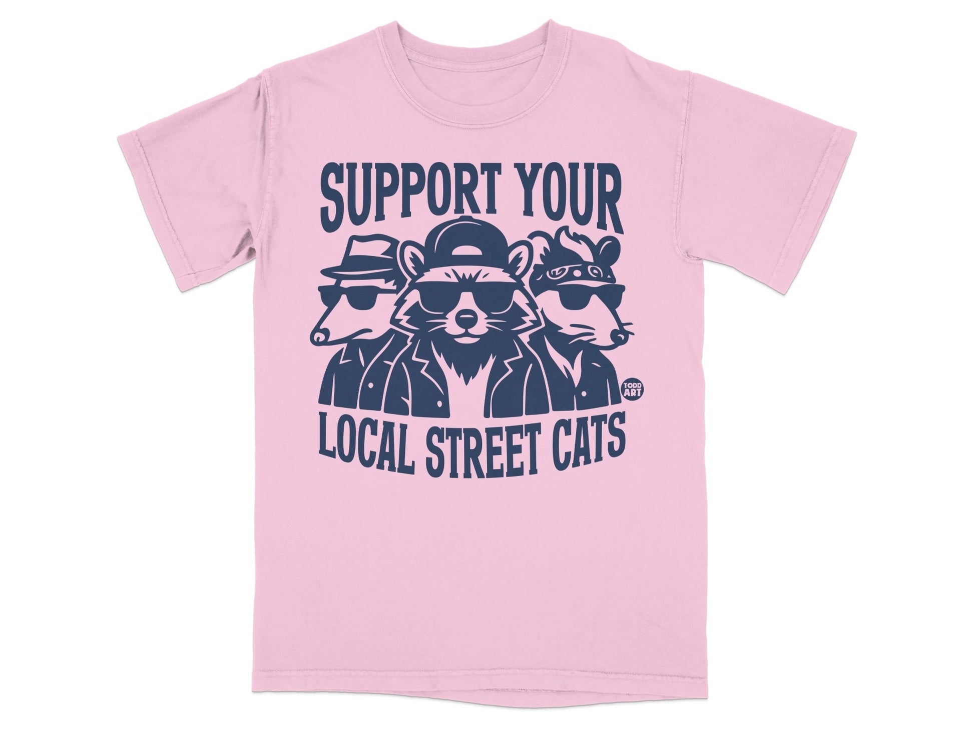 Three cartoon raccoons wearing sunglasses and hats on a pink t-shirt.