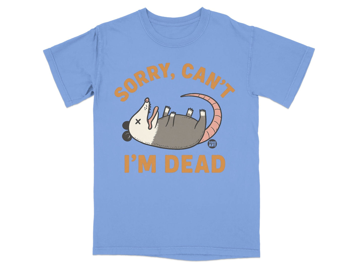 Light blue t-shirt with orange text "SORRY, CAN'T I'M DEAD" and a cartoon opossum.