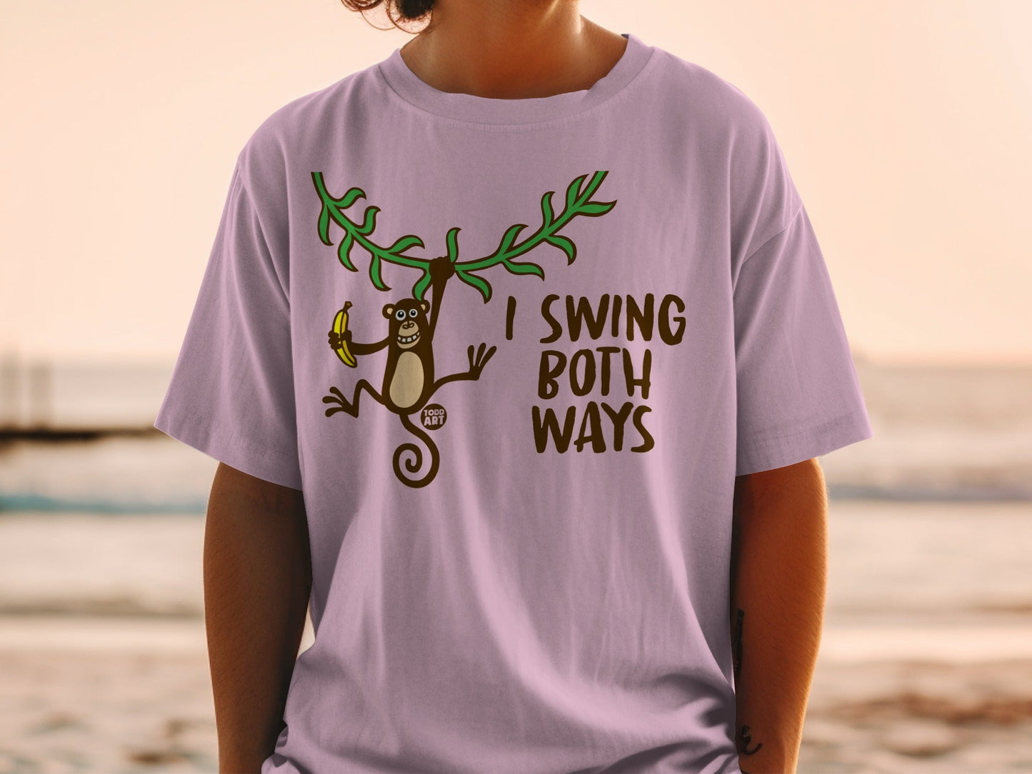 T-shirt with monkey holding banana, text "I SWING BOTH WAYS".