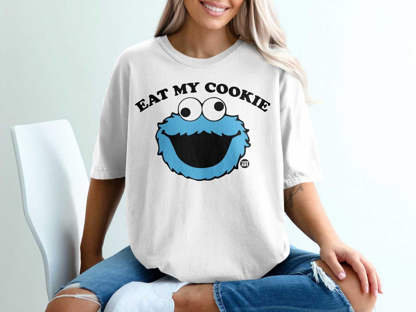 White t-shirt with Cookie Monster saying "Eat My Cookie"