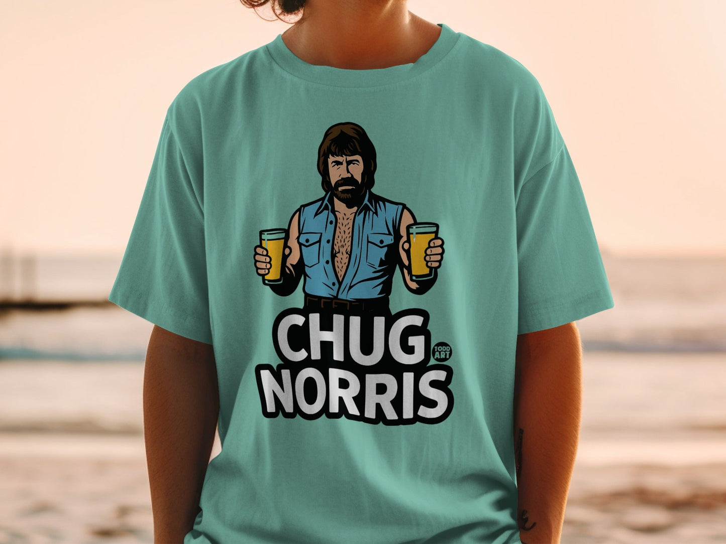 Chuck Norris in a teal t-shirt holding two beers.