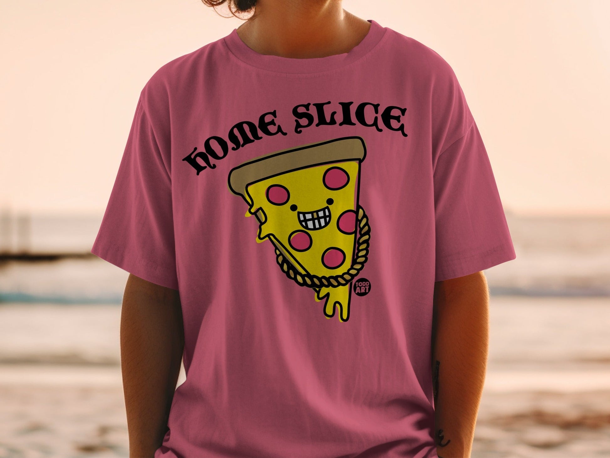 Pink t-shirt with cartoon pizza slice saying "HOME SLICE" and wearing a gold chain.
