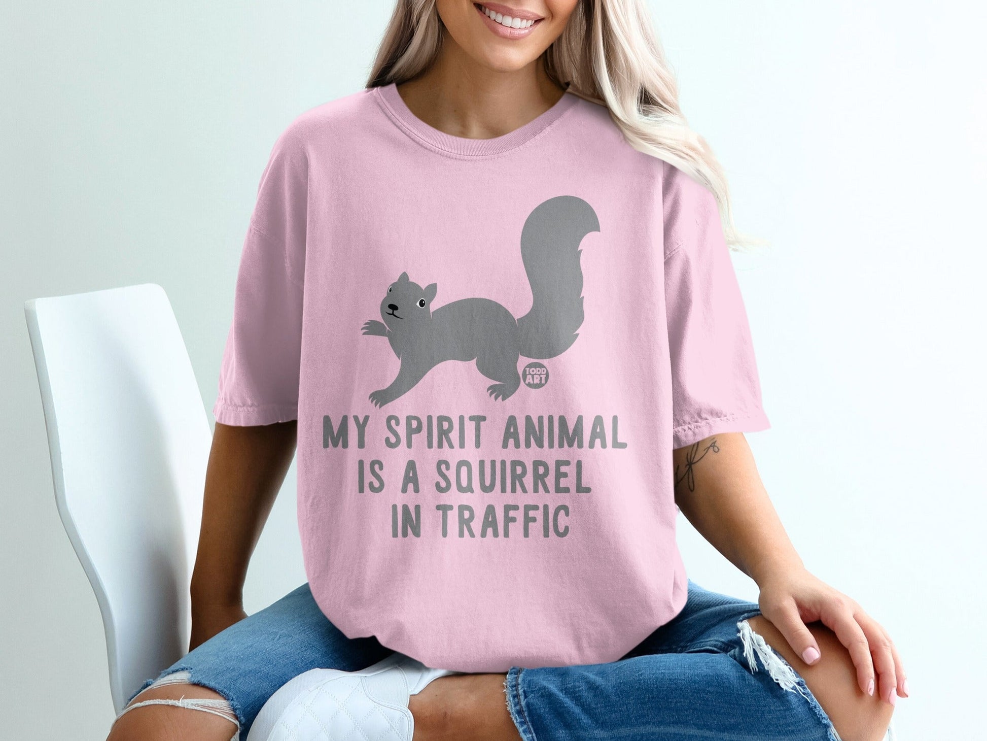 Pink t-shirt with "My spirit animal is a squirrel in traffic" and a squirrel graphic.